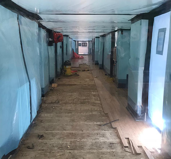 Asbestos removal in school corridor - enclosure construction