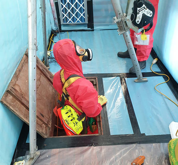 Asbestos removal from school corridor - confined space work