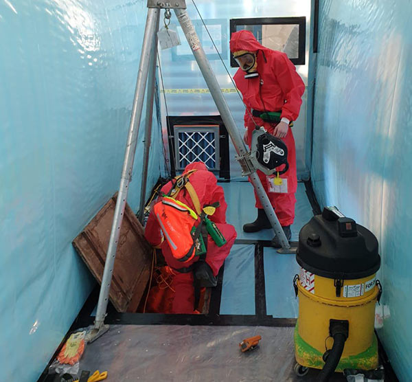 Asbestos removal from school corridor - confined space work