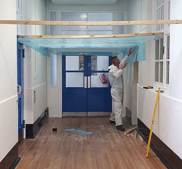 Asbestos removal from school corridor - enclosure construction