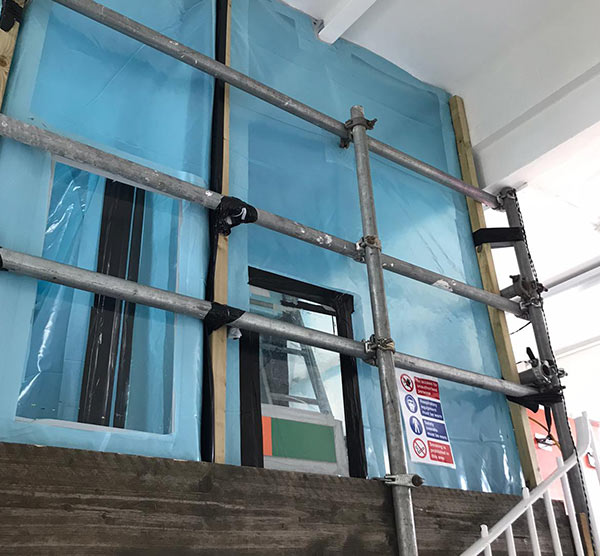 Asbestos removal from school corridor - enclosure construction